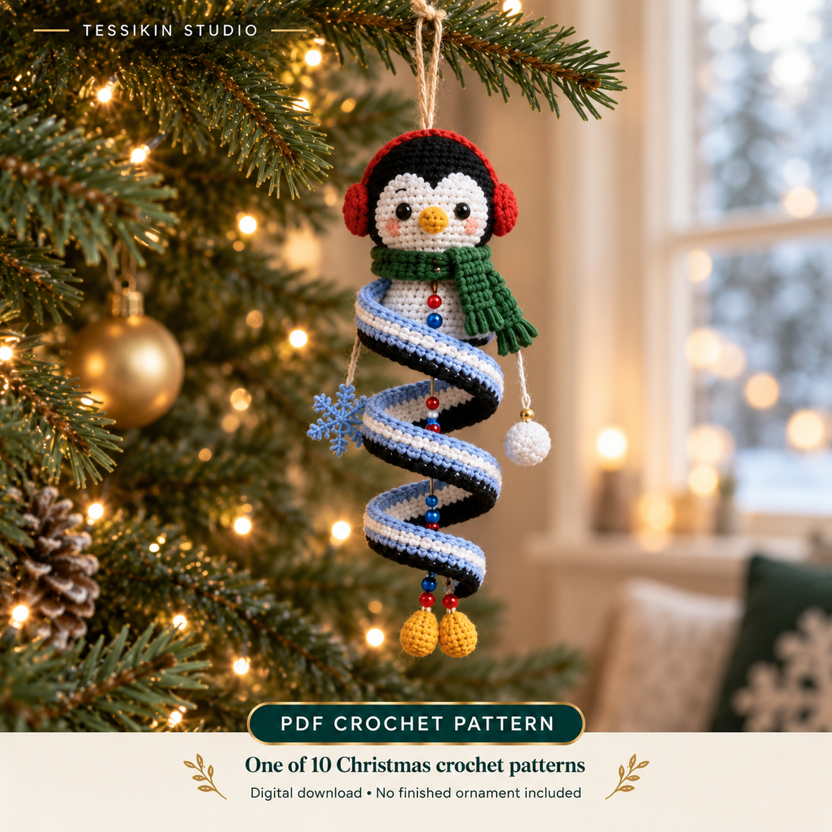 Penguin crochet spiral ornament design with red earmuffs, a green scarf, blue-and-white spiral and yellow feet.