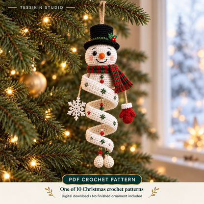 Snowman crochet spiral ornament design with a black top hat, red-and-green scarf and white spiral on a Christmas tree.